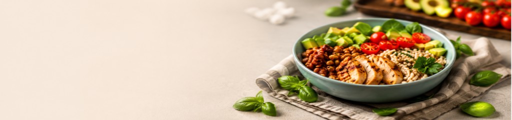 Fresh grain bowl with chicken, avocado, and vegetables